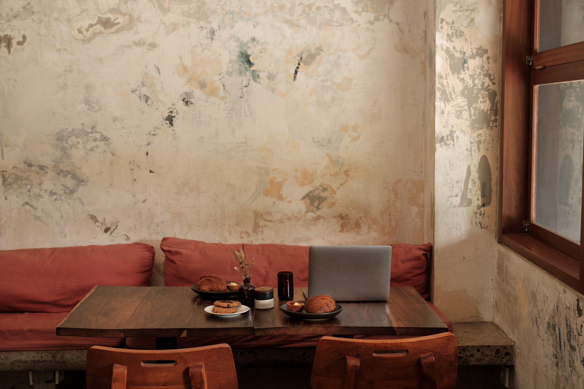 Laptop in a Rustic  Cafe Setup 